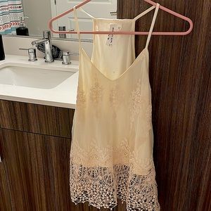 Small cream white nice tank with sea through lace on the bottom